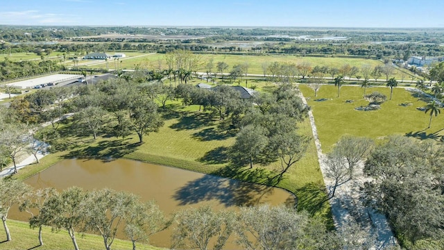 birds eye view of property with a water view and a rural view