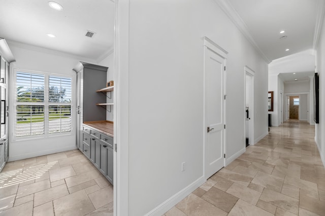 hallway featuring crown molding