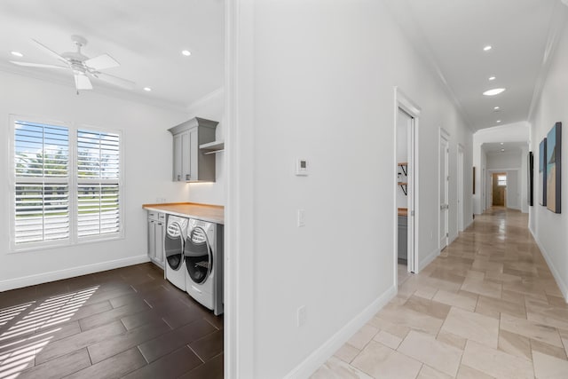 washroom featuring ceiling fan, crown molding, and washing machine and clothes dryer