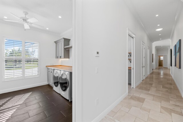 clothes washing area featuring crown molding, ceiling fan, and washer and dryer