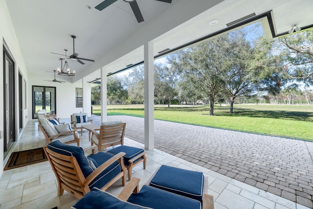 view of patio / terrace featuring ceiling fan and an outdoor living space