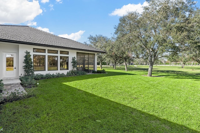 view of yard with a sunroom