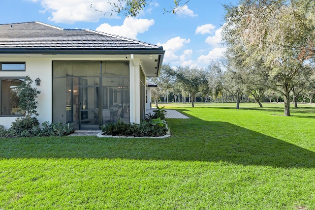 view of yard with a sunroom