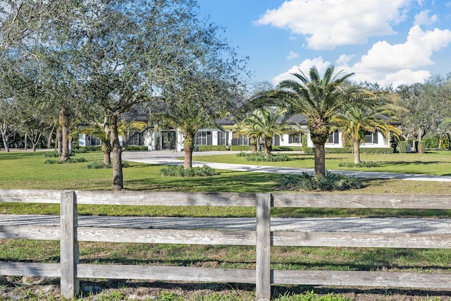 view of property's community featuring a yard