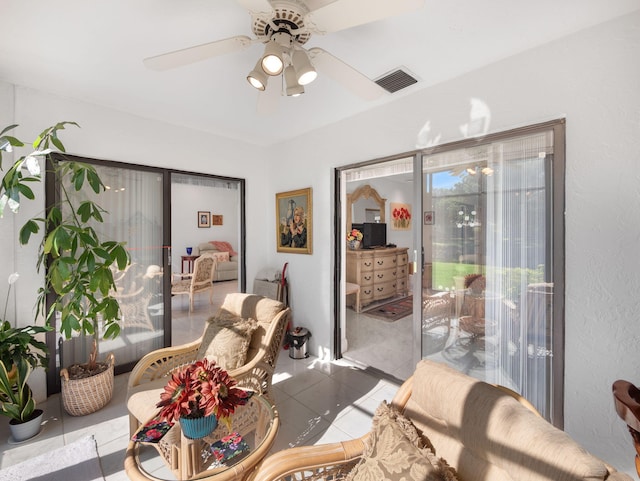 dining room featuring ceiling fan and tile patterned flooring