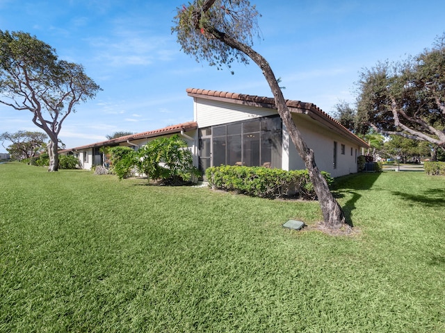 view of yard with a sunroom