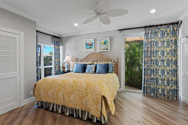 bedroom featuring ceiling fan, crown molding, and wood-type flooring