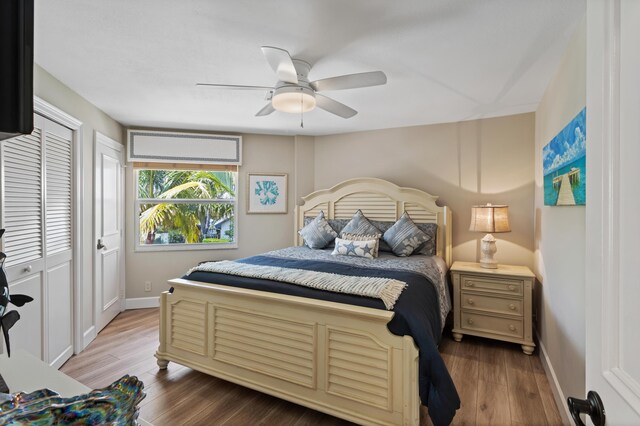 bedroom featuring a closet, hardwood / wood-style flooring, and ceiling fan