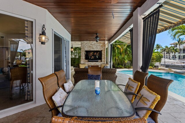 view of patio with an outdoor stone fireplace