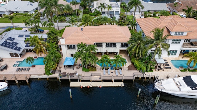 birds eye view of property with a water view