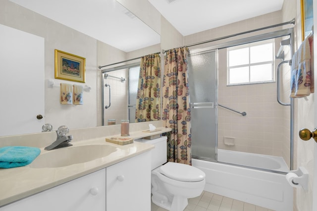 full bathroom with tile patterned floors, vanity, toilet, and tiled shower / bath