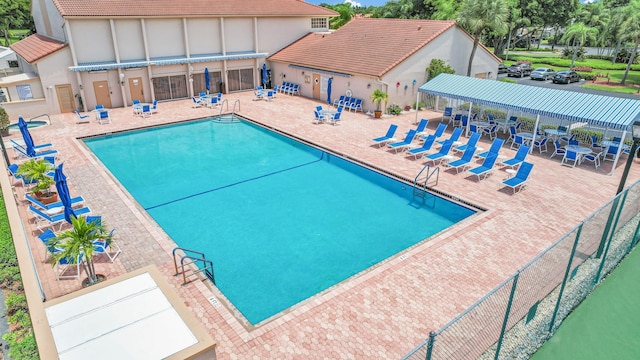 view of swimming pool featuring a patio area