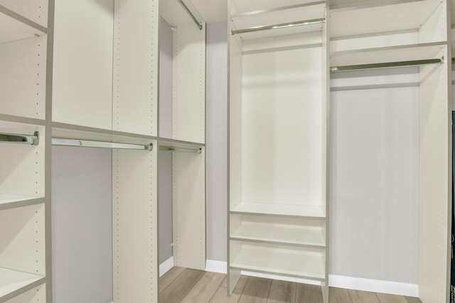 walk in closet featuring light hardwood / wood-style floors