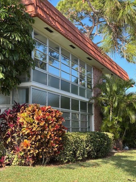 view of side of home featuring a yard