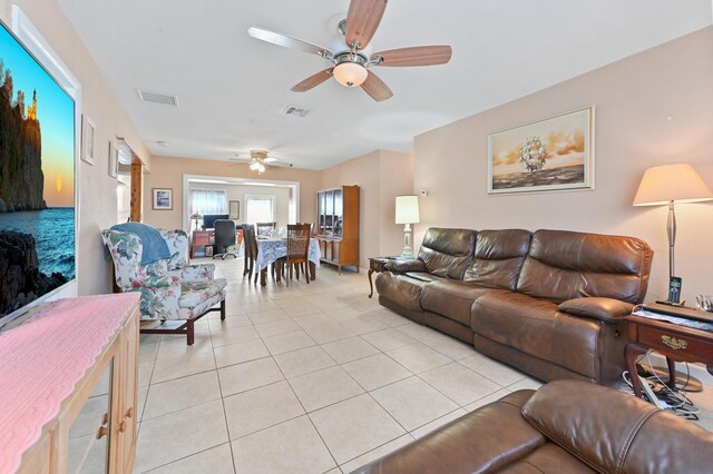 kitchen featuring stainless steel appliances, light tile patterned flooring, sink, and backsplash