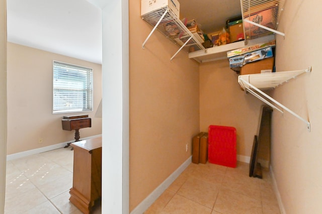 spacious closet with tile patterned floors