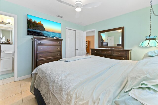 tiled bedroom featuring ceiling fan