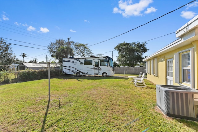 view of yard featuring central AC