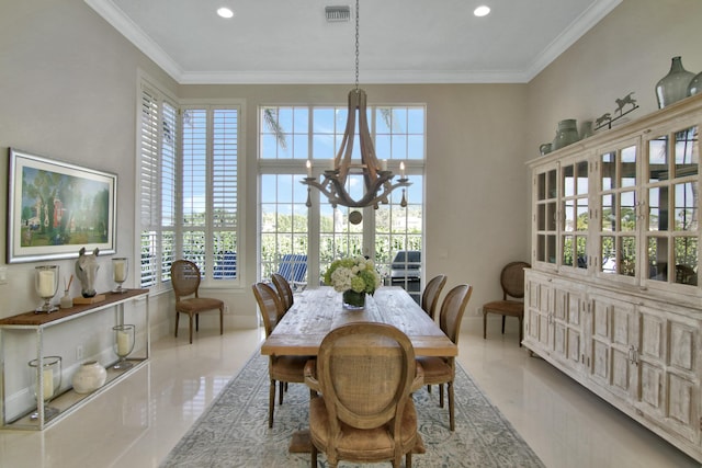 dining space featuring an inviting chandelier, ornamental molding, and plenty of natural light