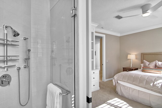 bedroom featuring a textured ceiling, ornamental molding, light colored carpet, and ceiling fan