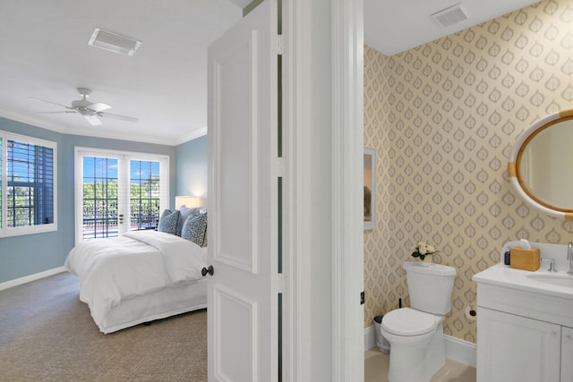 bedroom featuring crown molding, ceiling fan, carpet floors, and sink