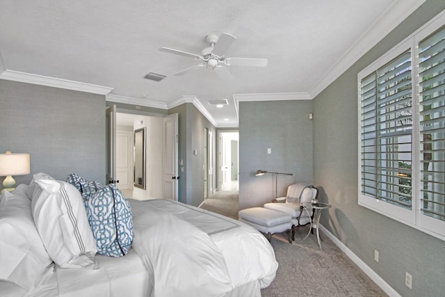 carpeted bedroom featuring ornamental molding and ceiling fan