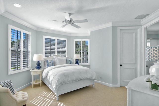 carpeted bedroom with multiple windows, ornamental molding, and a textured ceiling