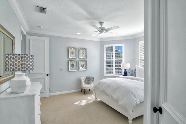 bedroom featuring crown molding, ceiling fan, light carpet, and a textured ceiling