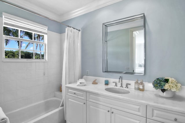 bathroom with shower / bath combo, ornamental molding, and vanity