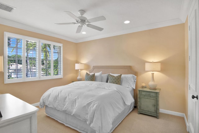 bedroom featuring crown molding, ceiling fan, and light carpet