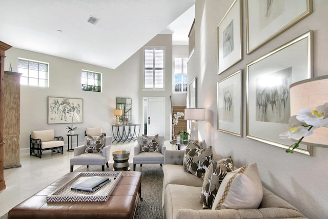 living room with a towering ceiling