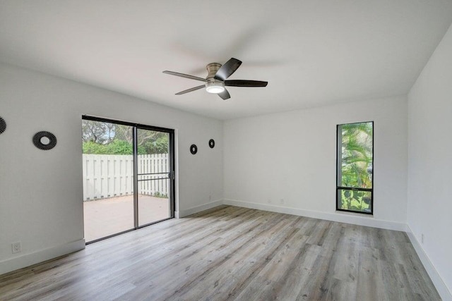 empty room featuring ceiling fan and light hardwood / wood-style floors