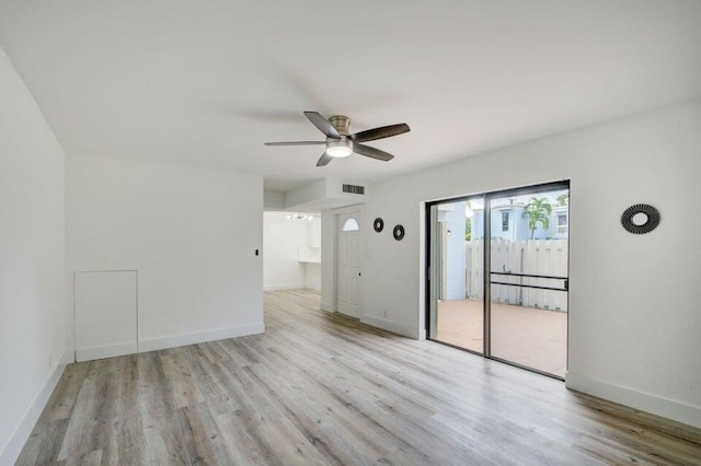 unfurnished room featuring light wood-type flooring and ceiling fan