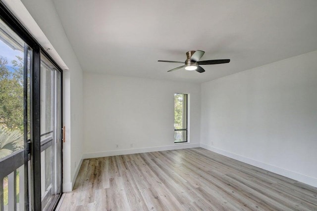 spare room featuring light hardwood / wood-style flooring and ceiling fan