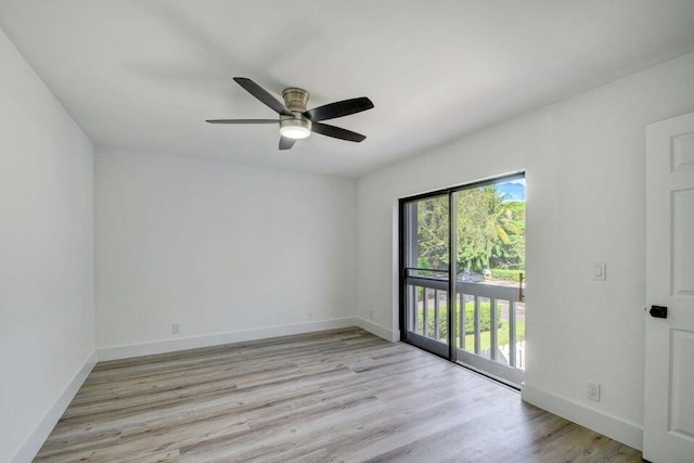 spare room with ceiling fan and light wood-type flooring