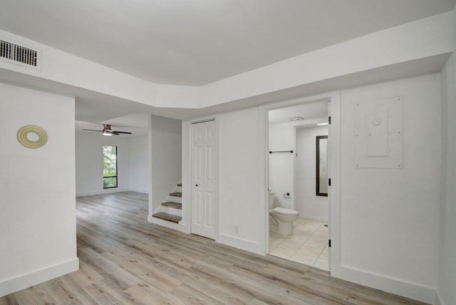 unfurnished room with ceiling fan and light wood-type flooring