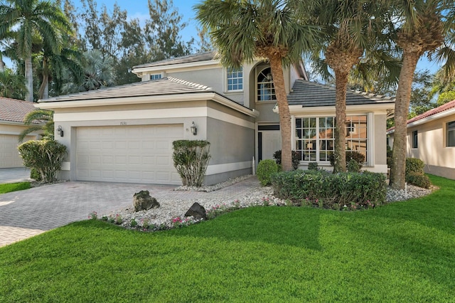 view of front facade with a garage and a front yard