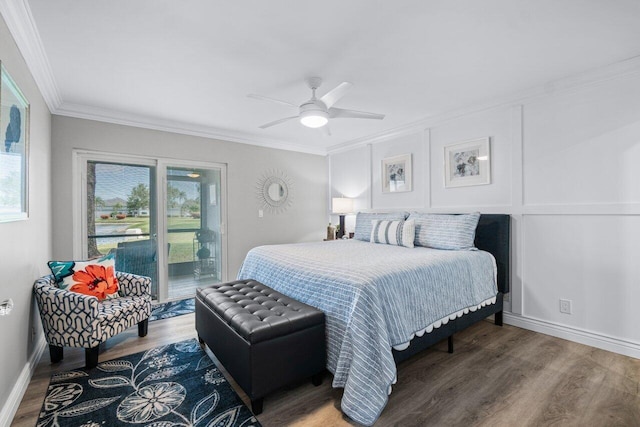 bedroom featuring ceiling fan, wood finished floors, baseboards, access to outside, and ornamental molding