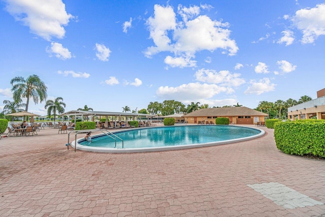 pool featuring a gazebo and a patio area