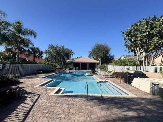 view of swimming pool featuring a patio area