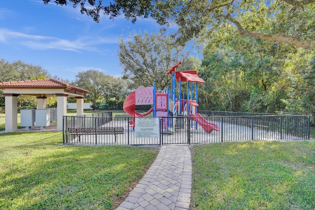 view of jungle gym with a lawn