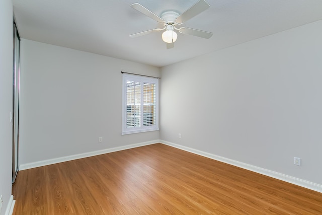 spare room featuring ceiling fan and light wood-type flooring