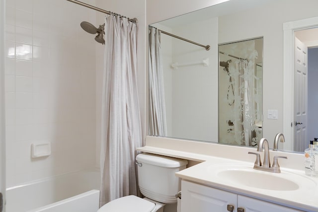 full bathroom with vanity, toilet, and shower / bath combo with shower curtain