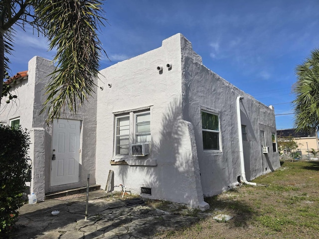 back of property featuring cooling unit