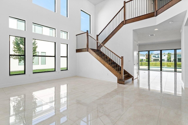 foyer entrance featuring a high ceiling