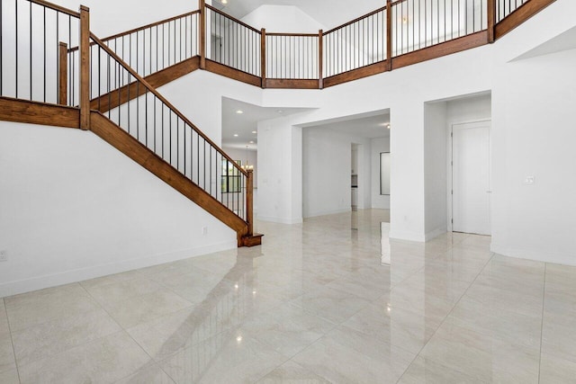 staircase with a high ceiling