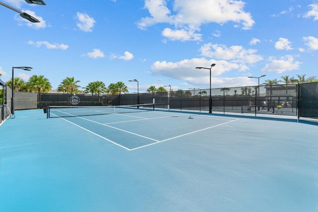 view of sport court featuring basketball hoop