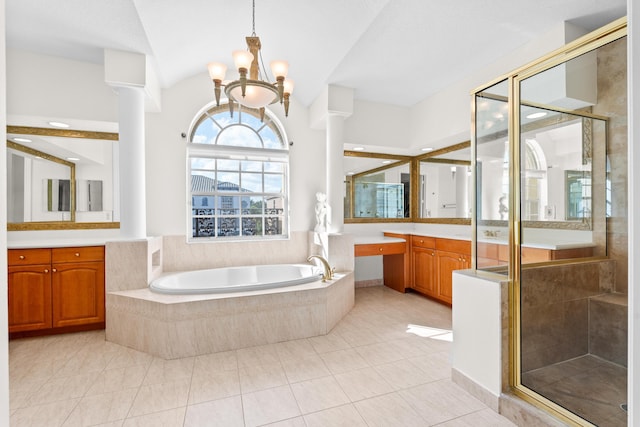 bathroom featuring lofted ceiling, vanity, separate shower and tub, and ornate columns