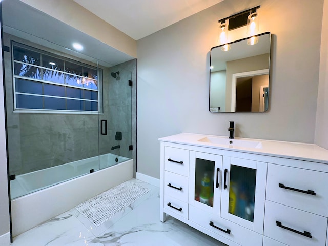 bathroom with bath / shower combo with glass door and vanity