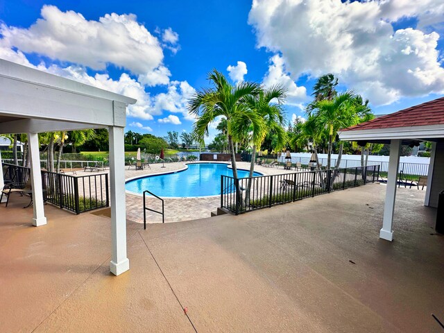 view of swimming pool featuring a patio area